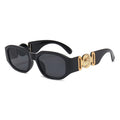 Schwarze Vintage Sonnenbrille mit goldenen Applikationen