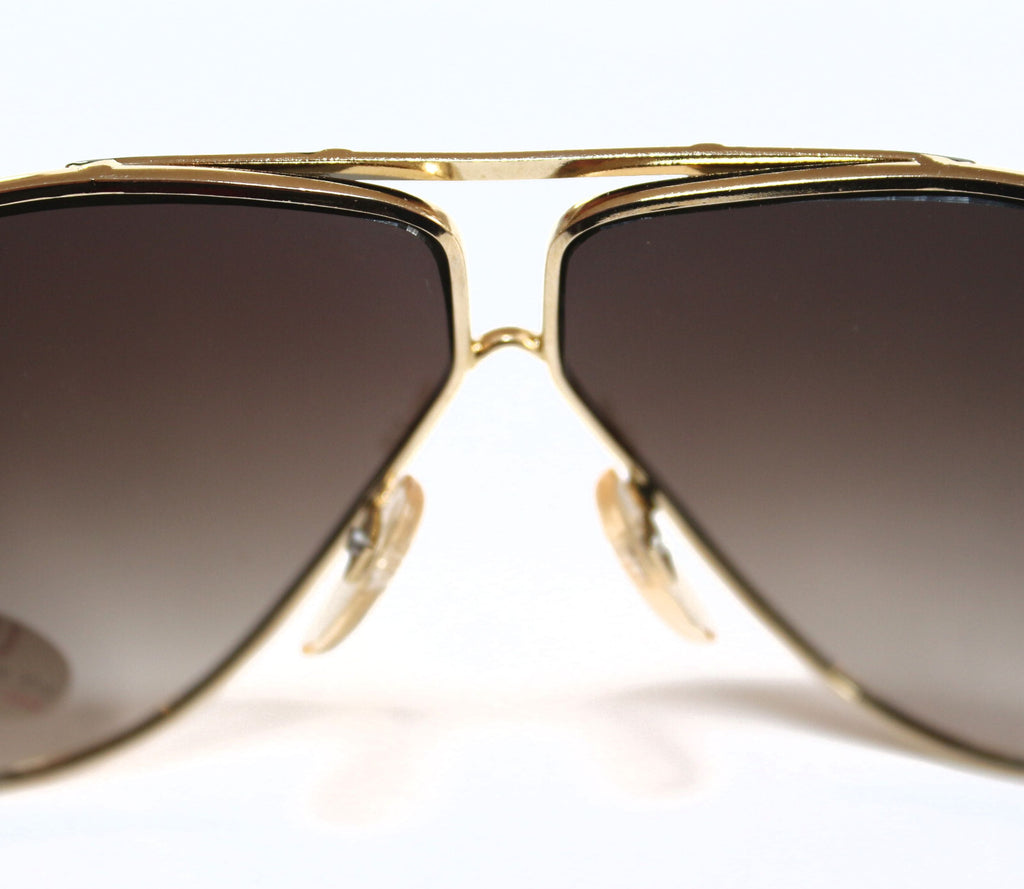 Gold-schwarze Piloten-Sonnenbrille im Porsche-Stil