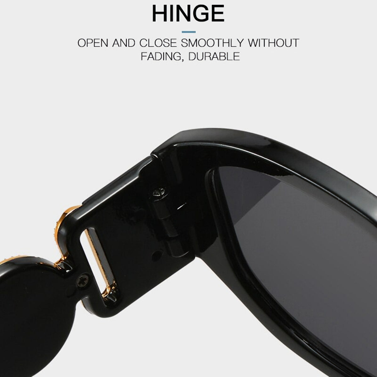 Schwarze Vintage Sonnenbrille mit goldenen Applikationen