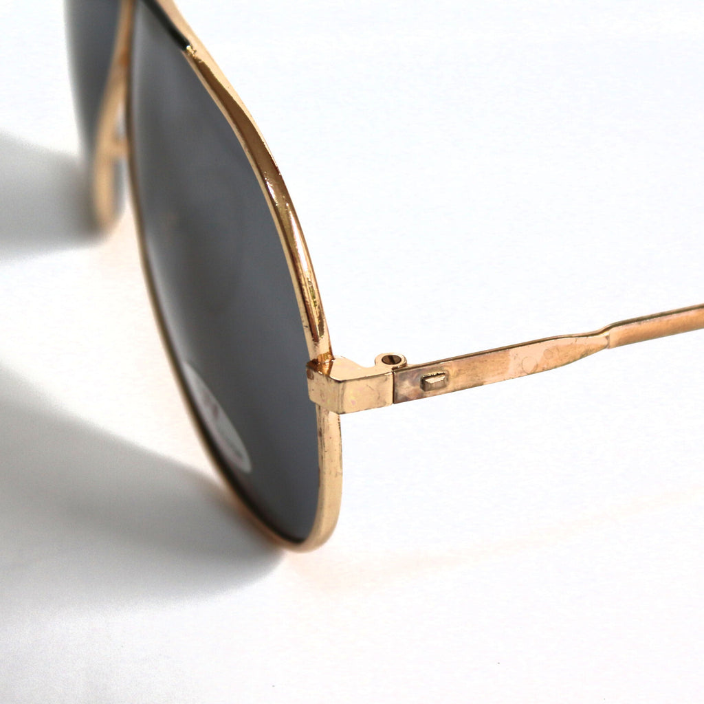 Gold-schwarze Piloten-Sonnenbrille im Porsche-Stil